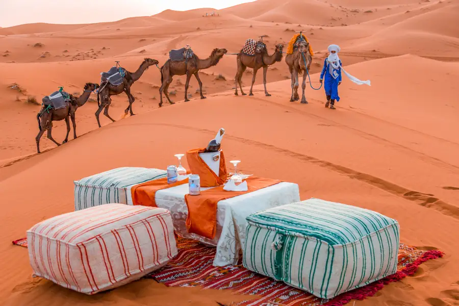 Low seating and rugs at a desert camp lounge