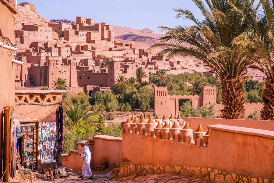 A shaded terrace and pool at a Moroccan kasbah hotel