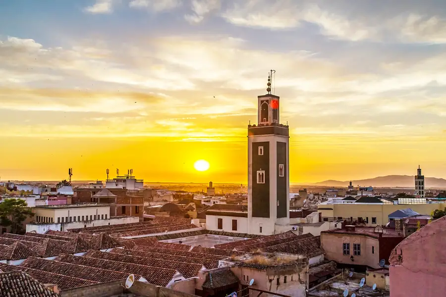 Koutoubia Mosque at sunset over the Marrakech rooftops